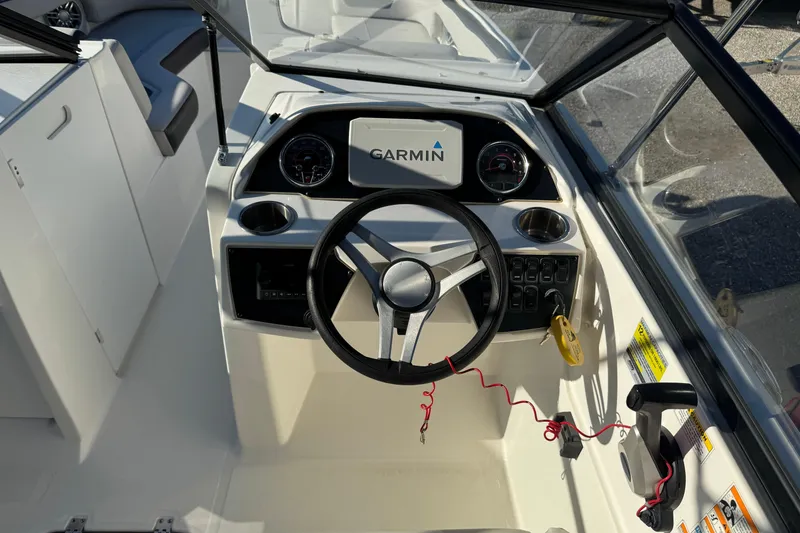 Slide: The Image of 2022 Hurricane SunDeck 235 OB boat dashboard with Garmin navigation system. - 21