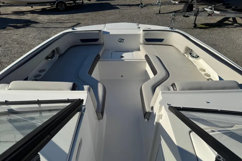 Slide: The Image of 2022 Hurricane SunDeck 235 OB boat interior with spacious seating and modern design. - 23