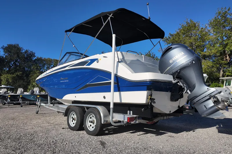 Slide: The Image of 2022 Hurricane SunDeck 235 OB boat on trailer with Yamaha outboard motor. - 8