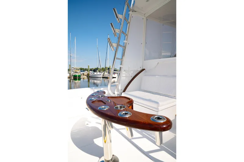 Slide: The Image of Luxury yacht deck with seating and rod holders, Front Runner 47WA, 2026 model. - 10