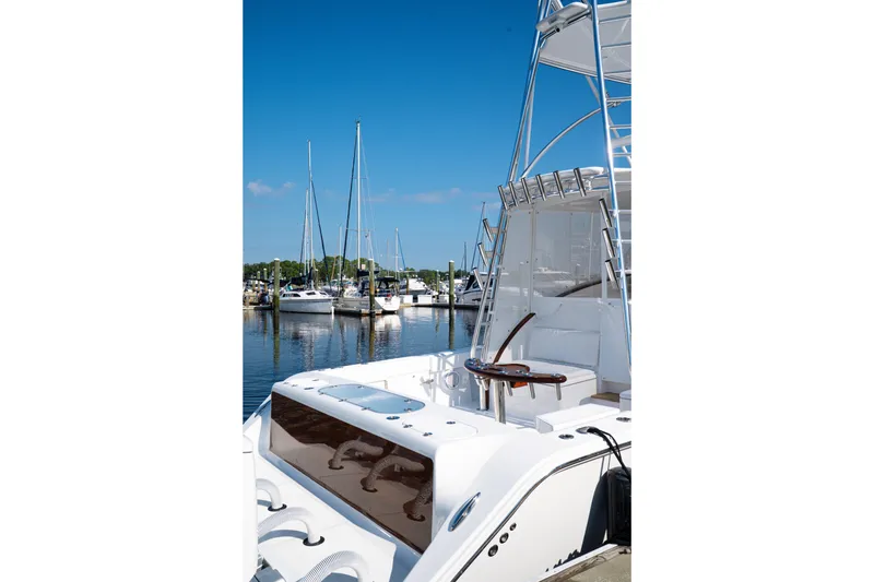 Slide: The Image of 2026 Front Runner 47WA boat docked at marina with clear blue sky. - 24