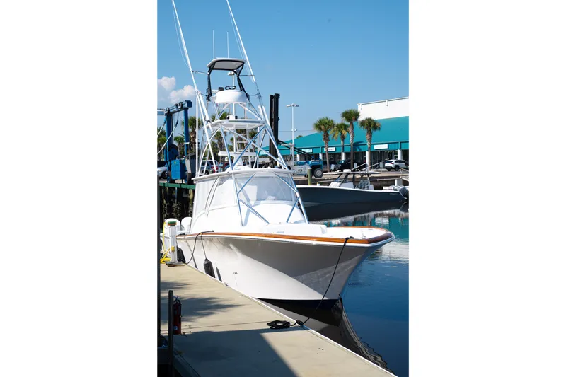 Slide: The Image of 2026 Front Runner 47WA boat docked at marina under clear blue sky. - 36
