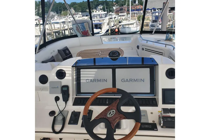 Slide: The Image of 2007 Sea Ray 580 Sedan Bridge helm with Garmin navigation, docked at marina. - 10