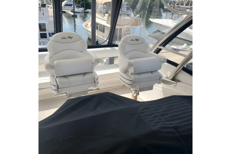 Slide: The Image of Luxury seating on 2007 Sea Ray 580 Sedan Bridge yacht, docked at marina. - 14
