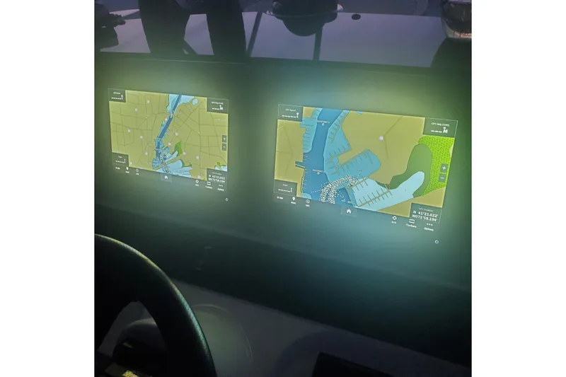 Slide: The Image of Navigation screens on a 2007 Sea Ray 580 Sedan Bridge yacht dashboard. - 16