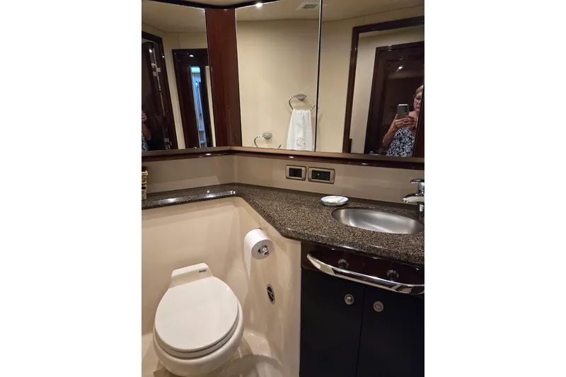 Slide: The Image of Luxurious bathroom in 2007 Sea Ray 580 Sedan Bridge yacht with granite countertop and modern fixtures. - 23