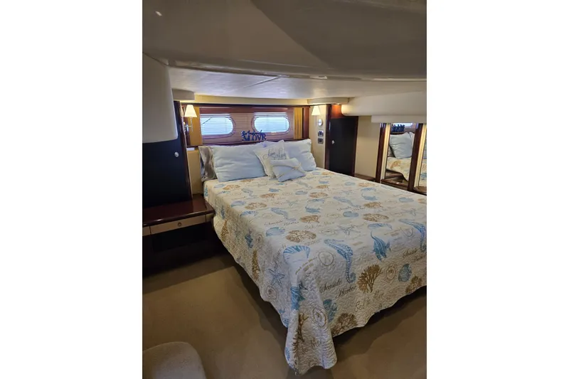 Slide: The Image of Luxurious bedroom interior of 2007 Sea Ray 580 Sedan Bridge yacht. - 27
