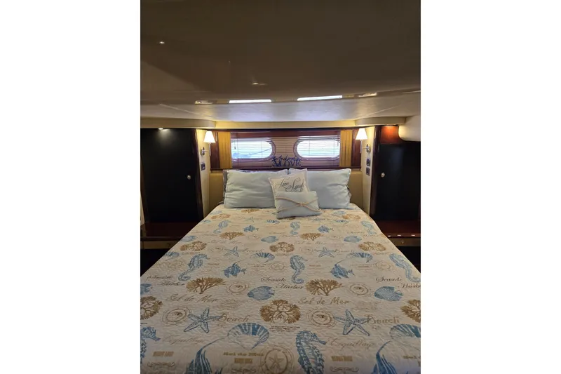 Slide: The Image of Luxurious bedroom interior of 2007 Sea Ray 580 Sedan Bridge yacht. - 28