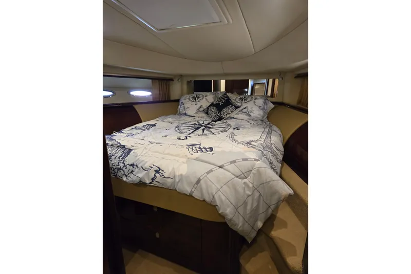 Slide: The Image of Luxurious bedroom interior of 2007 Sea Ray 580 Sedan Bridge yacht. - 34