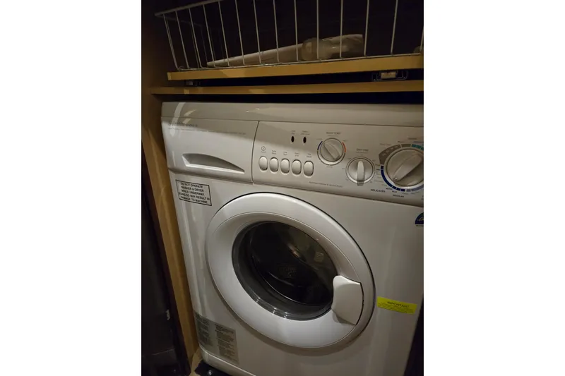 Slide: The Image of Washing machine inside 2007 Sea Ray 580 Sedan Bridge yacht laundry area. - 36