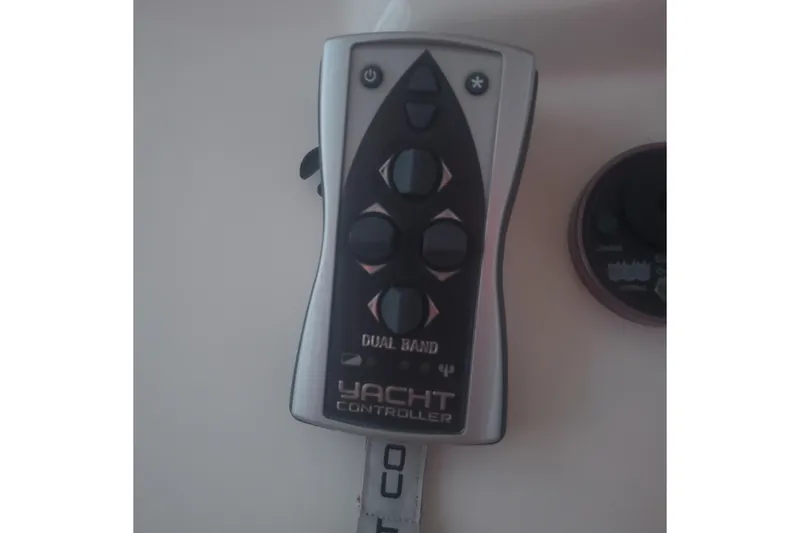 Slide: The Image of Remote control for 2007 Sea Ray 580 Sedan Bridge yacht, featuring dual-band functionality. - 37