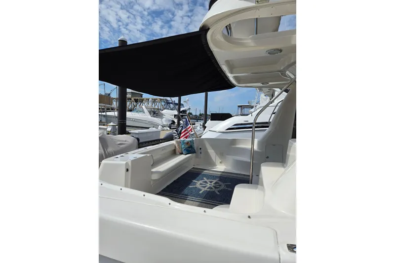 Slide: The Image of 2007 Sea Ray 580 Sedan Bridge yacht with shaded seating area and nautical decor. - 4