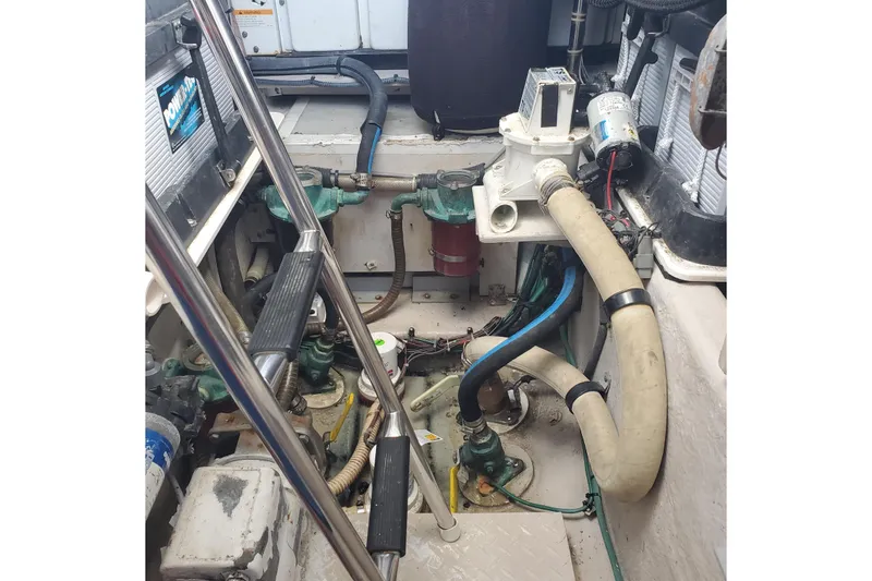 Slide: The Image of Engine room of 2007 Sea Ray 580 Sedan Bridge with visible pipes and machinery. - 6
