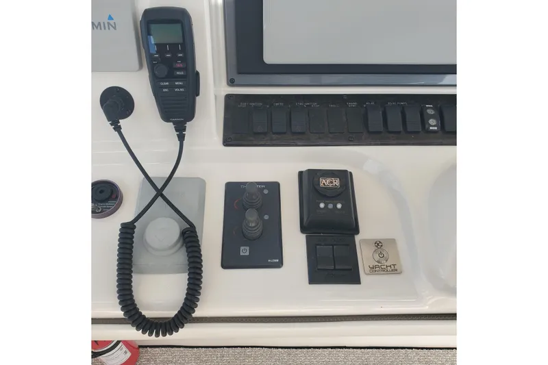 Slide: The Image of Control panel of a 2007 Sea Ray 580 Sedan Bridge yacht with various navigation instruments. - 9