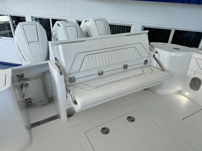 Slide: The Image of 2025 Intrepid 41 Panacea boat with foldable seating and Mercury outboard engines. - 12