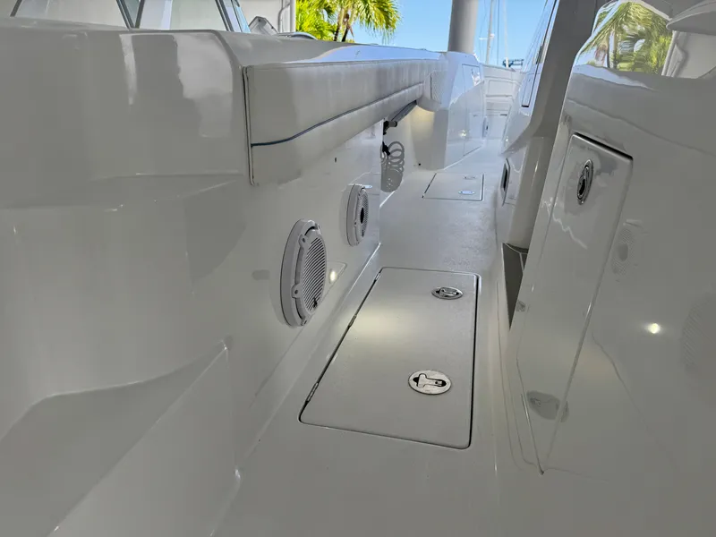 Slide: The Image of Interior view of 2025 Intrepid 41 Panacea boat, featuring sleek white design and modern fixtures. - 15