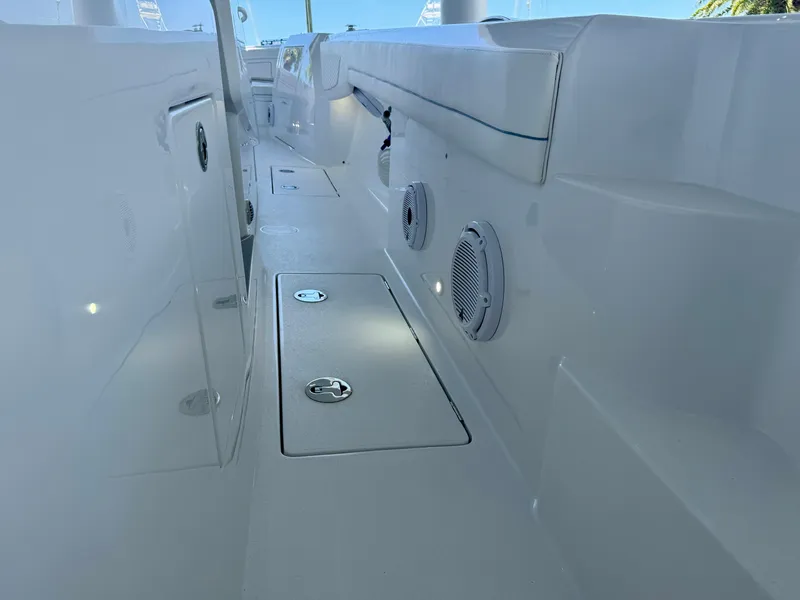 Slide: The Image of Interior view of 2025 Intrepid 41 Panacea boat, showcasing sleek design and storage compartments. - 16