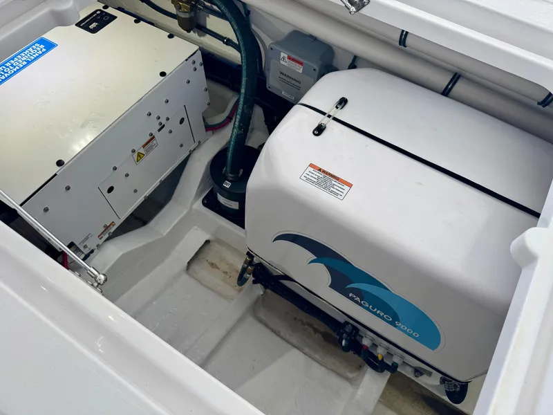 Slide: The Image of Engine compartment of 2025 Intrepid 41 Panacea, featuring Paguro 9000 generator. - 19