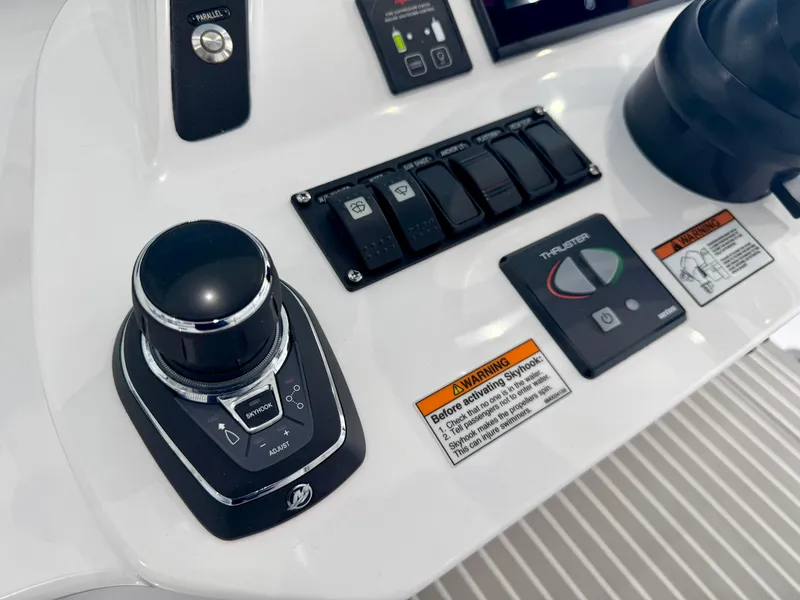 Slide: The Image of Control panel of 2025 Intrepid 41 Panacea boat featuring joystick and thruster controls. - 20