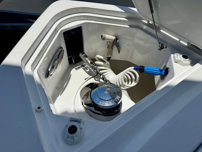 Slide: The Image of Anchor locker of 2025 Intrepid 41 Panacea with coiled hose and winch. - 23