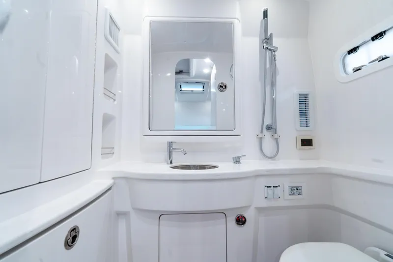Slide: The Image of Luxurious bathroom in 2025 Intrepid 41 Panacea yacht, featuring modern fixtures and sleek design. - 25