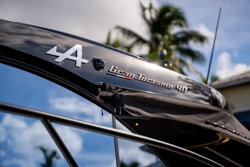 Slide: The Image of 2026 Beneteau Gran Turismo 40 yacht detail with palm trees in background. - 37