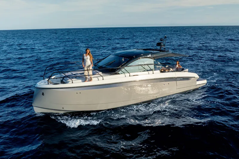 Slide: The Image of 2026 Beneteau Gran Turismo 40 yacht cruising on open sea with passengers onboard. - 39