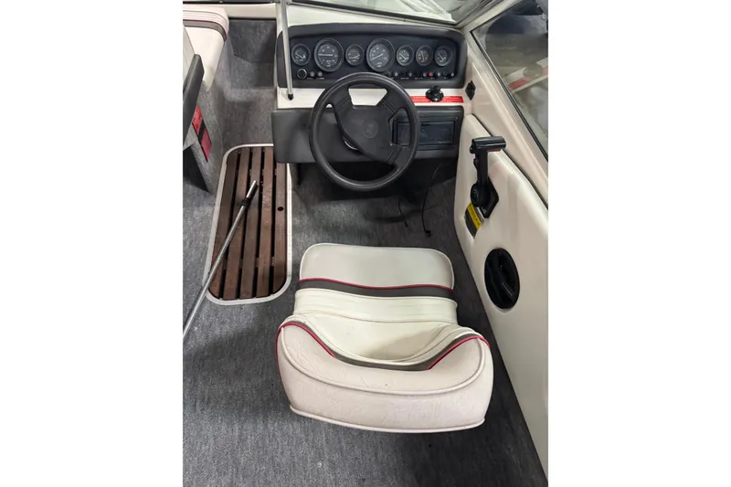 Slide: The Image of Interior of a 1993 Sea Ray 170 Bow Rider boat with steering wheel and dashboard. - 6