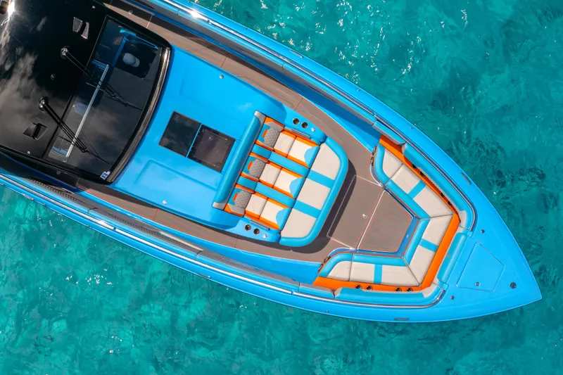 Slide: The Image of Aerial view of 2025 Cigarette 52 Thunder boat on clear turquoise water. - 4