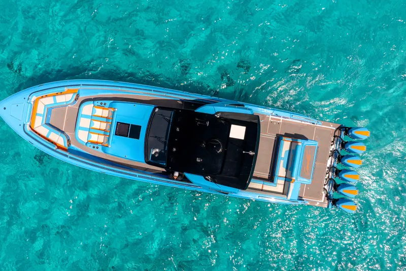 Slide: The Image of Aerial view of 2025 Cigarette 52 Thunder boat on clear turquoise water. - 5