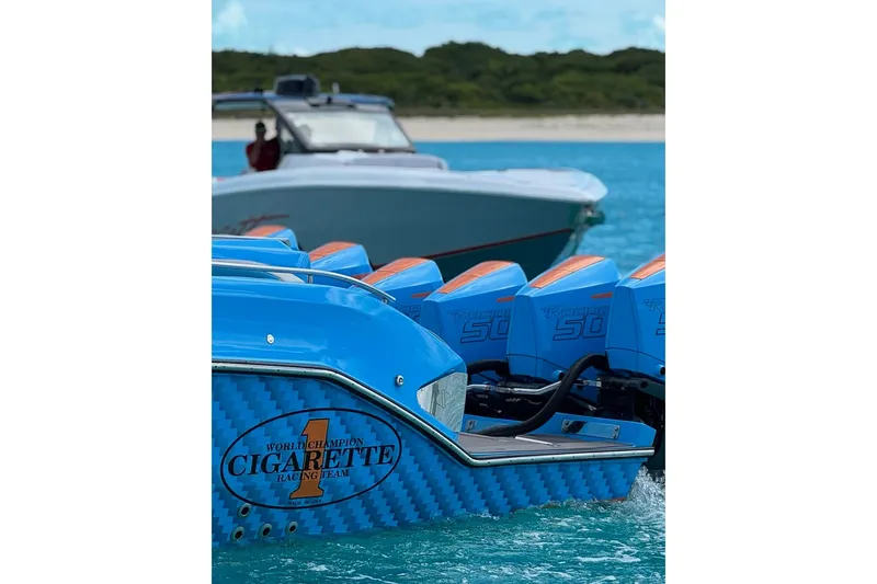 Slide: The Image of 2025 Cigarette 52 Thunder boat with multiple blue engines on turquoise water. - 6