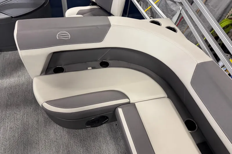 Slide: The Image of 2026 Sun Tracker Bass Buggy 18 DLX boat seating with cup holders and gray upholstery. - 11