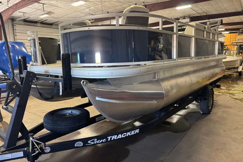 Slide: The Image of 2026 Sun Tracker Bass Buggy 18 DLX interior with swivel seat and console. - 16