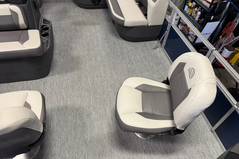 Slide: The Image of Interior of 2026 Sun Tracker Bass Buggy 18 DLX with comfortable seating and carpeted flooring. - 8