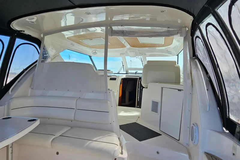 Slide: The Image of Interior of 2009 Tiara Yachts 4300 Sovran, featuring white seating and modern design. - 11