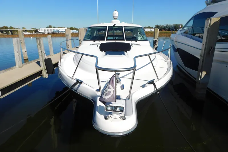 Slide: The Image of 2009 Tiara Yachts 4300 Sovran docked in a marina, front view. - 3