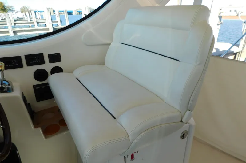 Slide: The Image of Luxurious white seating in 2009 Tiara Yachts 4300 Sovran cockpit area. - 30