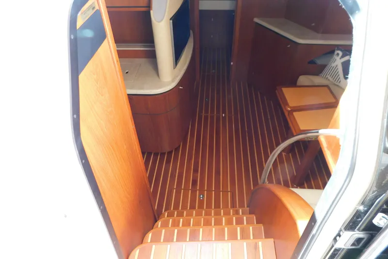 Slide: The Image of Interior view of 2009 Tiara Yachts 4300 Sovran with wooden flooring and cabinetry. - 31