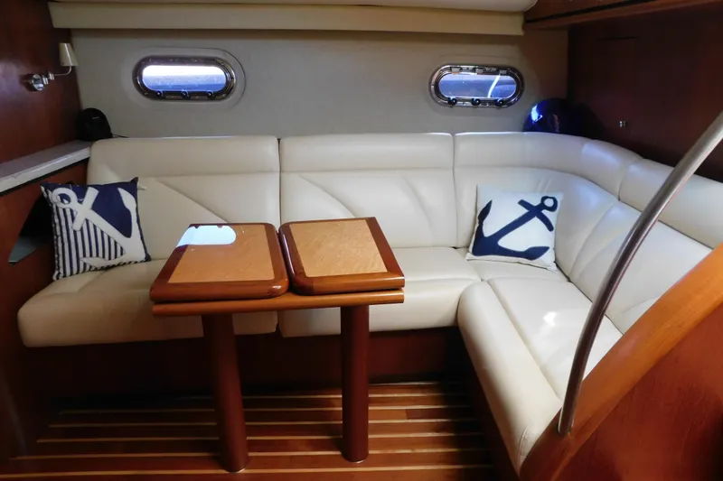 Slide: The Image of Luxurious 2009 Tiara Yachts 4300 Sovran interior with white leather seating and nautical decor. - 32