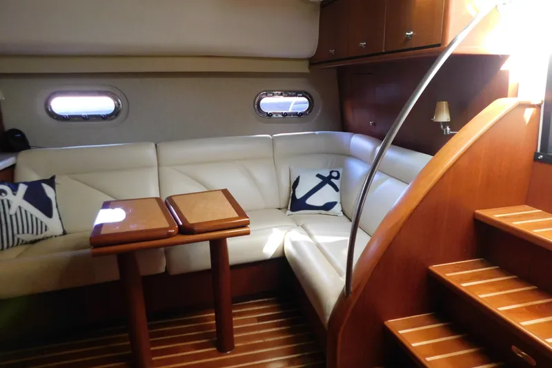 Slide: The Image of Luxurious interior of 2009 Tiara Yachts 4300 Sovran with leather seating and nautical decor. - 40