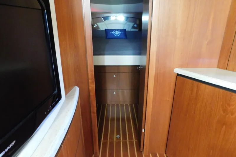 Slide: The Image of 2009 Tiara Yachts 4300 Sovran interior with wood finish and cozy cabin. - 45