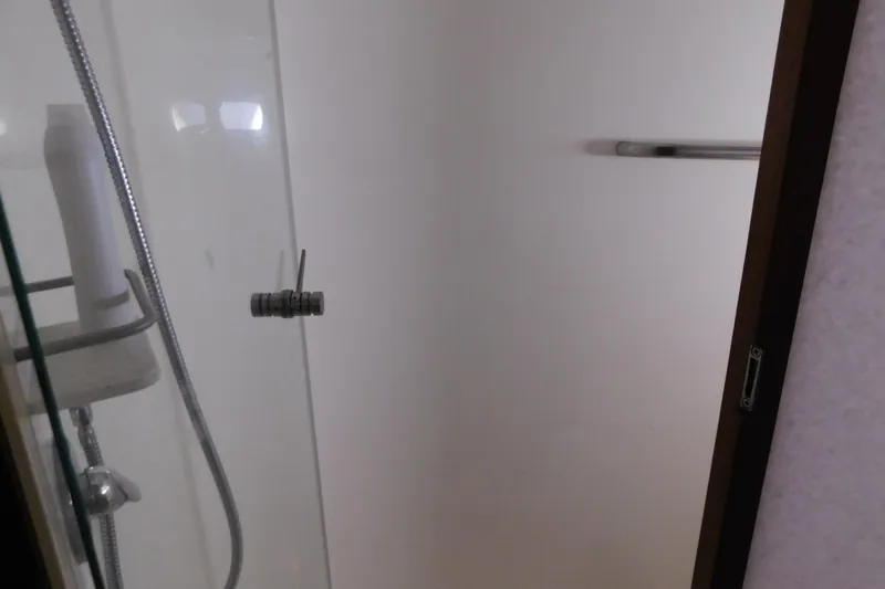 Slide: The Image of Shower area in 2009 Tiara Yachts 4300 Sovran, featuring glass door and modern fixtures. - 47