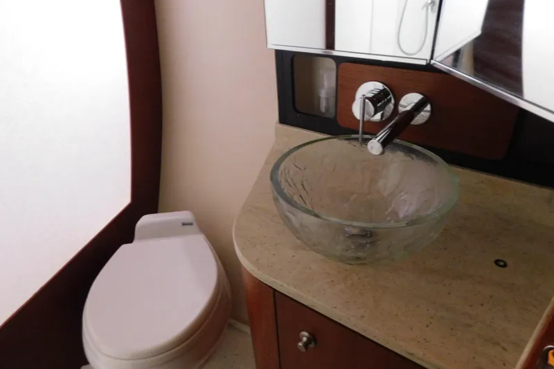 Slide: The Image of Luxurious bathroom in 2009 Tiara Yachts 4300 Sovran with glass sink and modern fixtures. - 48