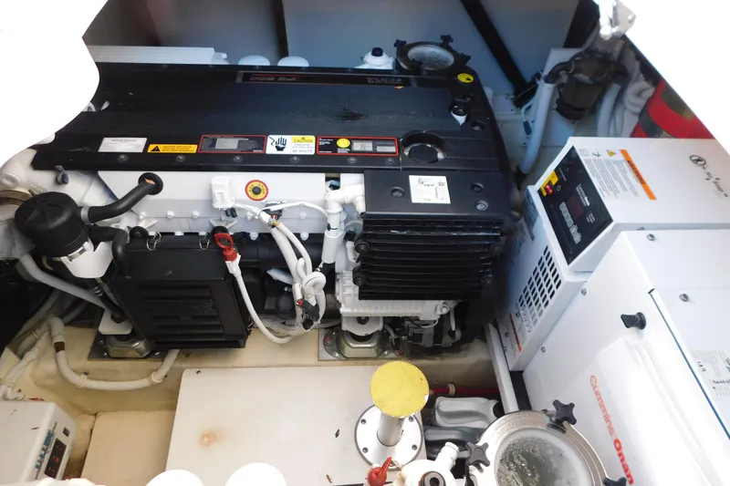 Slide: The Image of Engine room of 2009 Tiara Yachts 4300 Sovran, featuring Cummins Onan generator. - 52