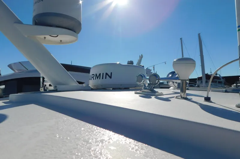 Slide: The Image of 2009 Tiara Yachts 4300 Sovran with Garmin equipment under clear blue sky. - 60