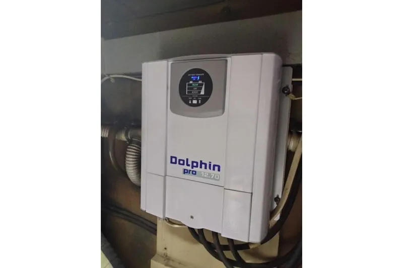 Slide: The Image of Dolphin Pro 12.70 battery charger mounted on wall, model Post 46 ll, 1988. - 18
