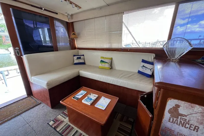 Slide: The Image of Cozy interior of 1988 Post 46 ll yacht with white seating and nautical decor. - 2