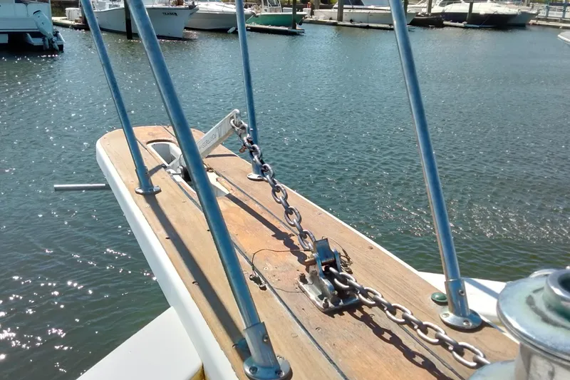 Slide: The Image of Bow of 1988 Post 46 ll boat with anchor chain, docked in marina. - 22