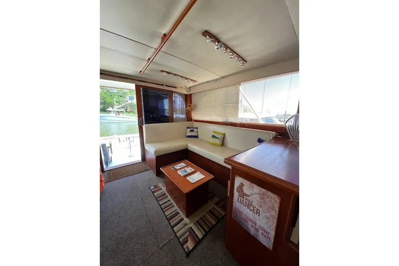 Slide: The Image of Interior of 1988 Post 46 ll yacht with cozy seating and nautical decor. - 6