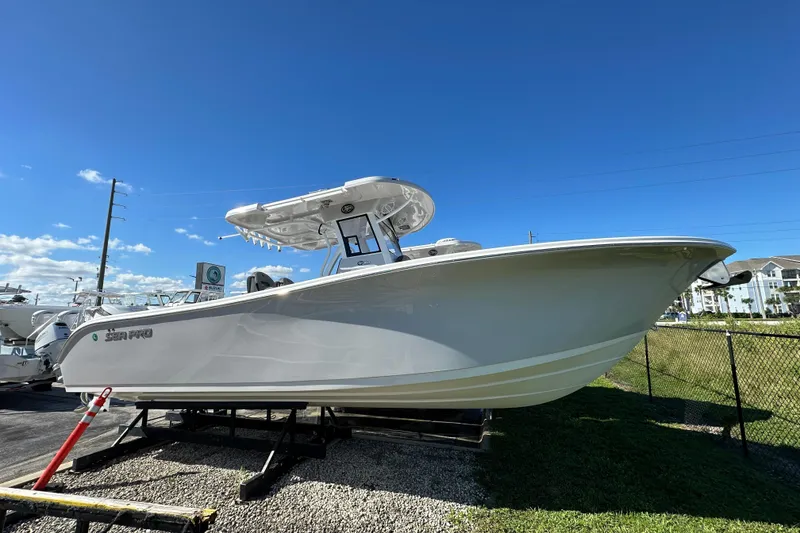 The Image of 2026 Sea Pro 292 Offshore boat displayed outdoors under clear blue sky. - 1